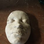 An image of a face mask - used as a mold in glass-making
