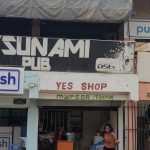 A picture of shop fronts including 'Yes' shop and Tsunami pub